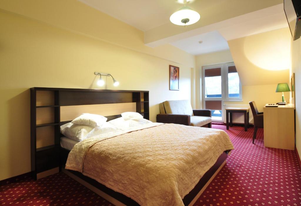 Postel nebo postele na pokoji v ubytování Hotel Continental