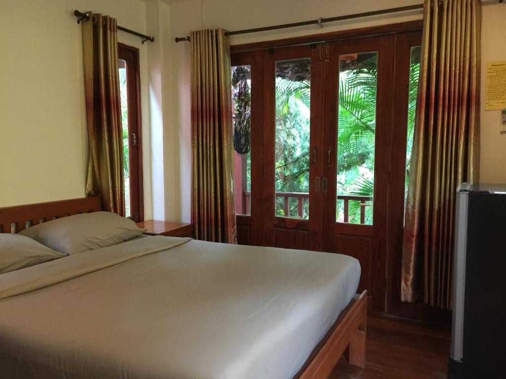 Postel nebo postele na pokoji v ubytování Pai Loess Resort