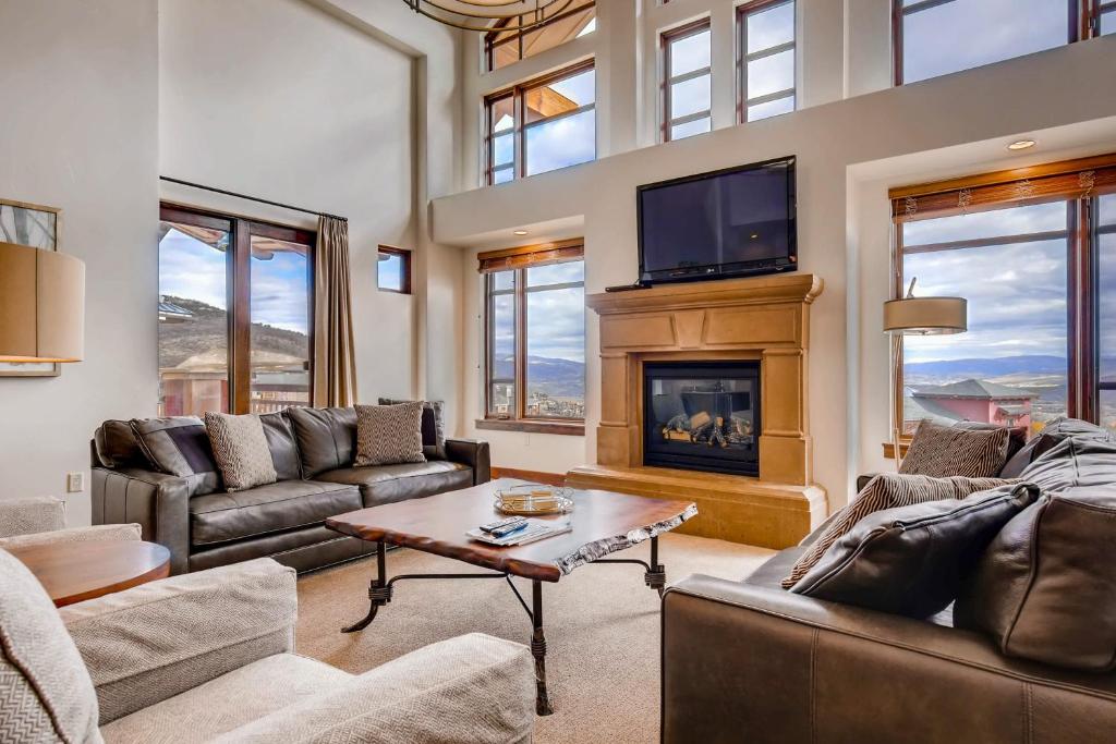 a living room with a couch and a fireplace at Hyatt Centric #450 in Park City