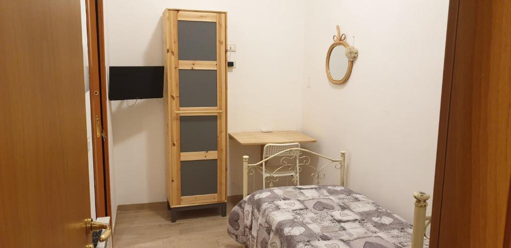 Postel nebo postele na pokoji v ubytování Affittacamere Raggio di sole