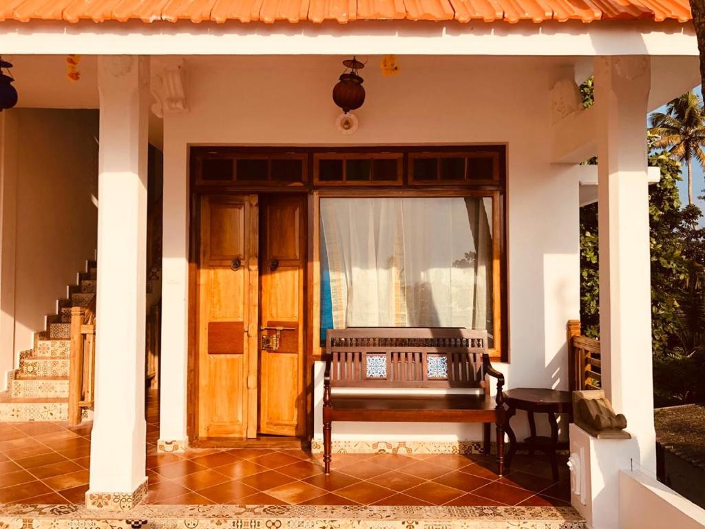 Balkón nebo terasa v ubytování Lemon Dew Beach House, Alleppey Beach