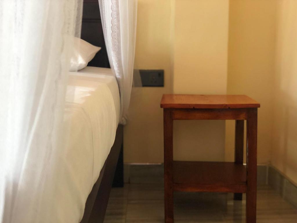 Postel nebo postele na pokoji v ubytování Jade Green Rest Inn