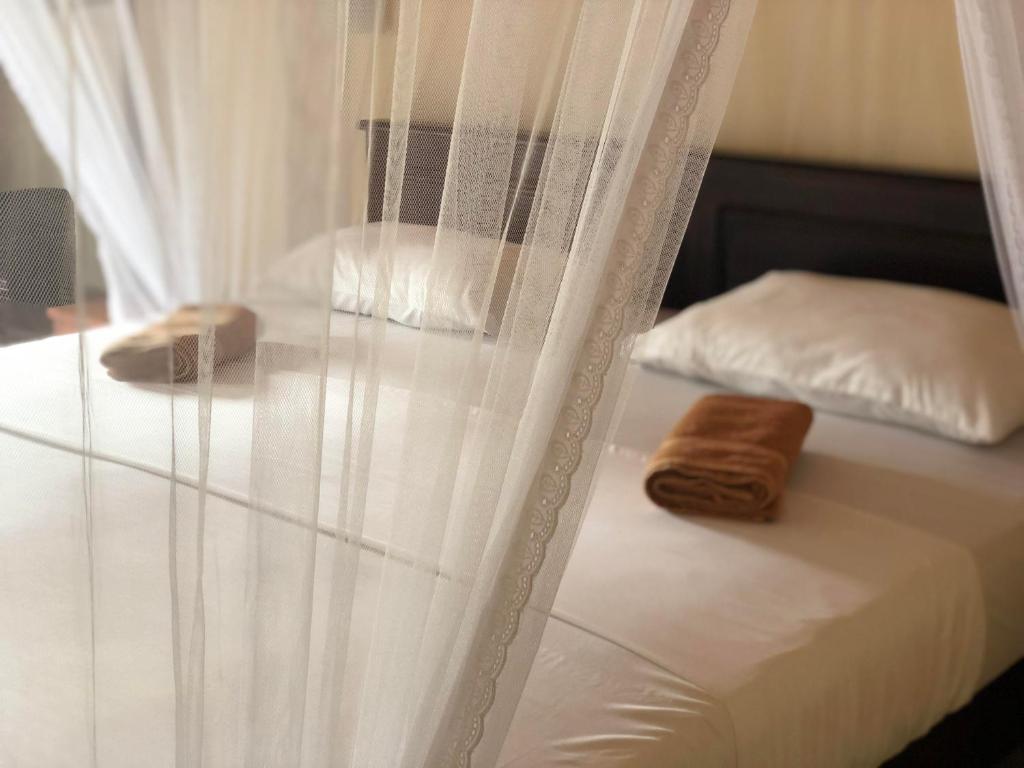Postel nebo postele na pokoji v ubytování Jade Green Rest Inn