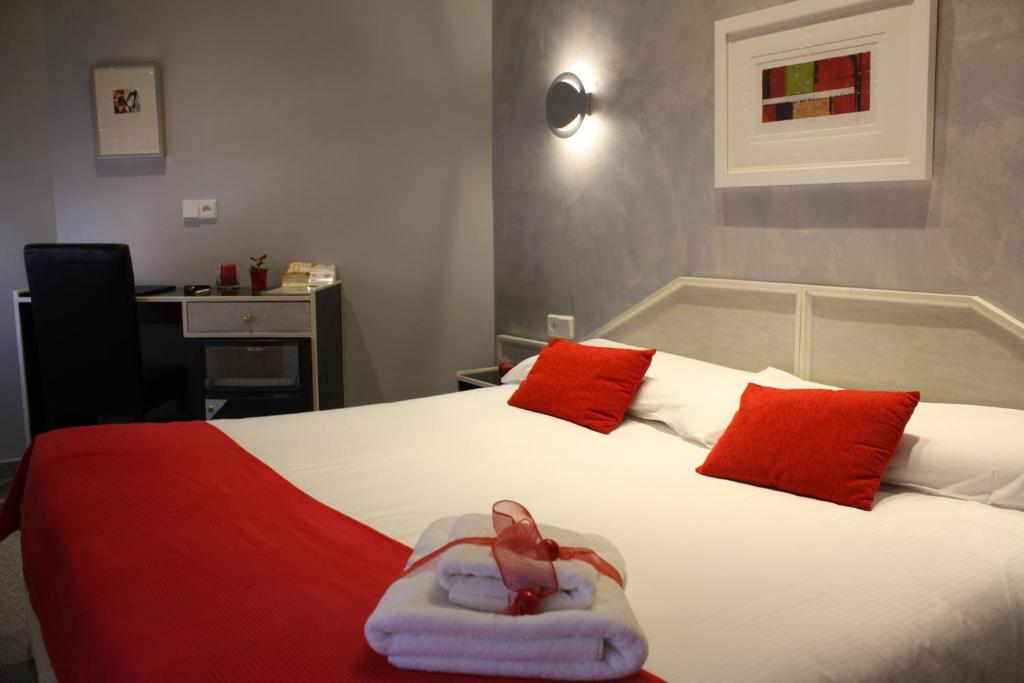 Cama o camas de una habitación en Hostal Paris