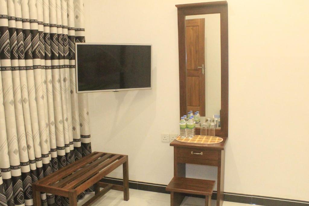 TV a/nebo společenská místnost v ubytování Hotel BEJEWELLED Sigiriya