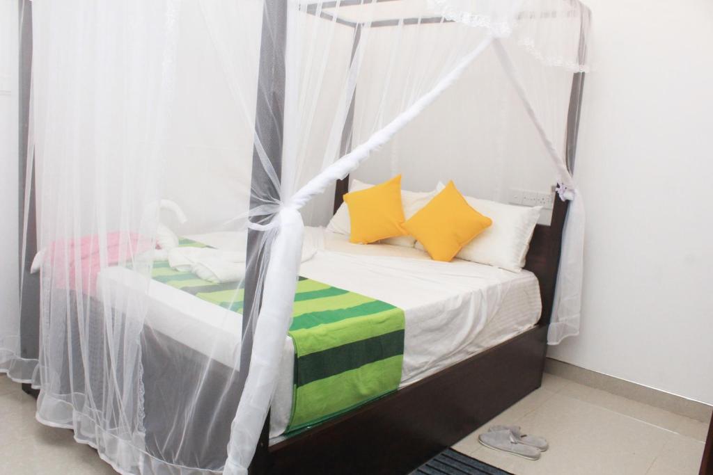 Postel nebo postele na pokoji v ubytování Hotel BEJEWELLED Sigiriya