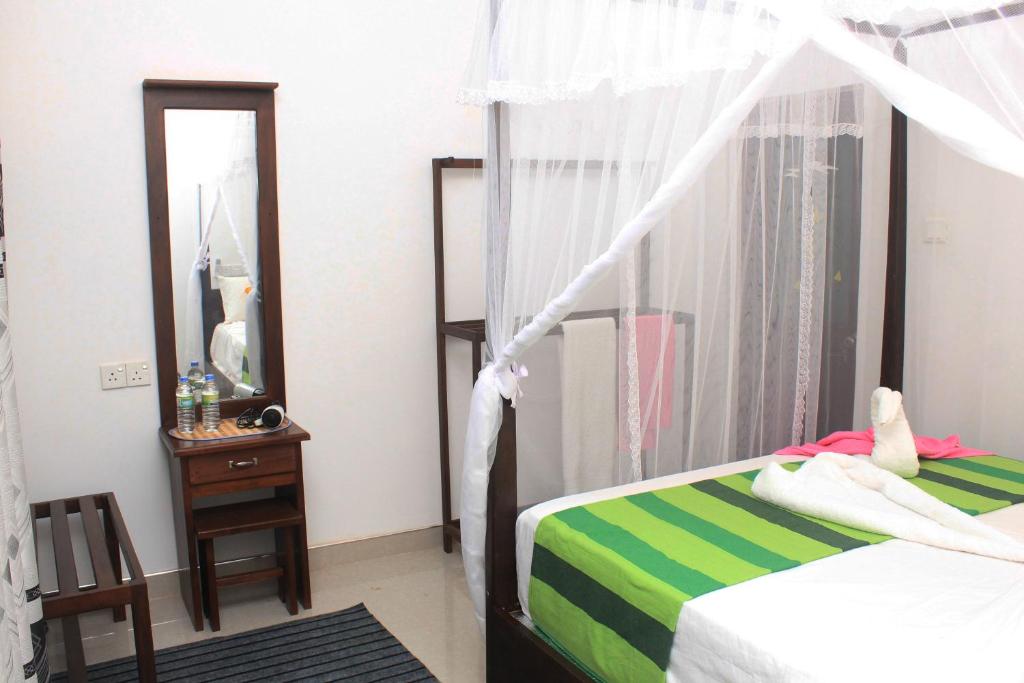 Postel nebo postele na pokoji v ubytování Hotel BEJEWELLED Sigiriya