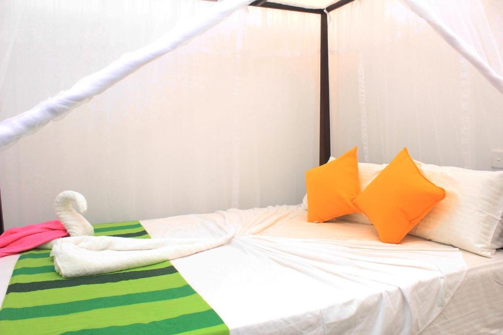 Postel nebo postele na pokoji v ubytování Hotel BEJEWELLED Sigiriya