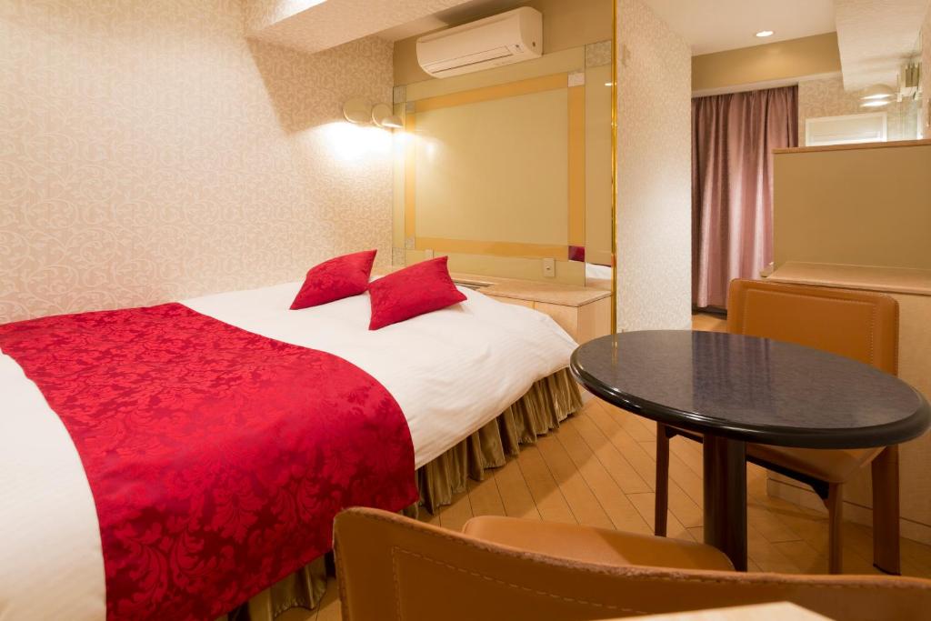 Postel nebo postele na pokoji v ubytování Hotel Route One