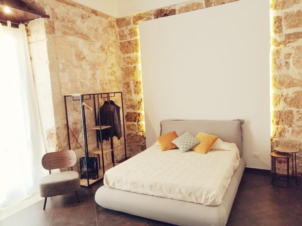 Postel nebo postele na pokoji v ubytování GARIBALDI MAISON DE CHARME