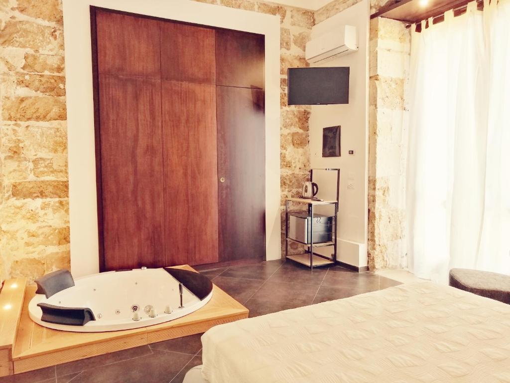 Postel nebo postele na pokoji v ubytování GARIBALDI MAISON DE CHARME