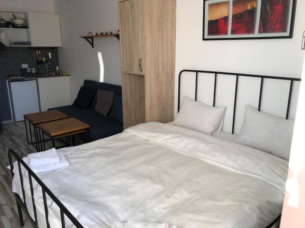 Postel nebo postele na pokoji v ubytování Studio apartment #507 in Gudauri Loft