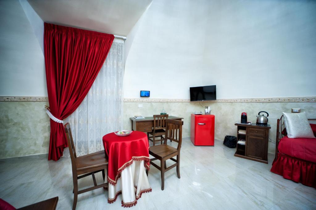 Televízia a/alebo spoločenská miestnosť v ubytovaní B&B Punto Stella