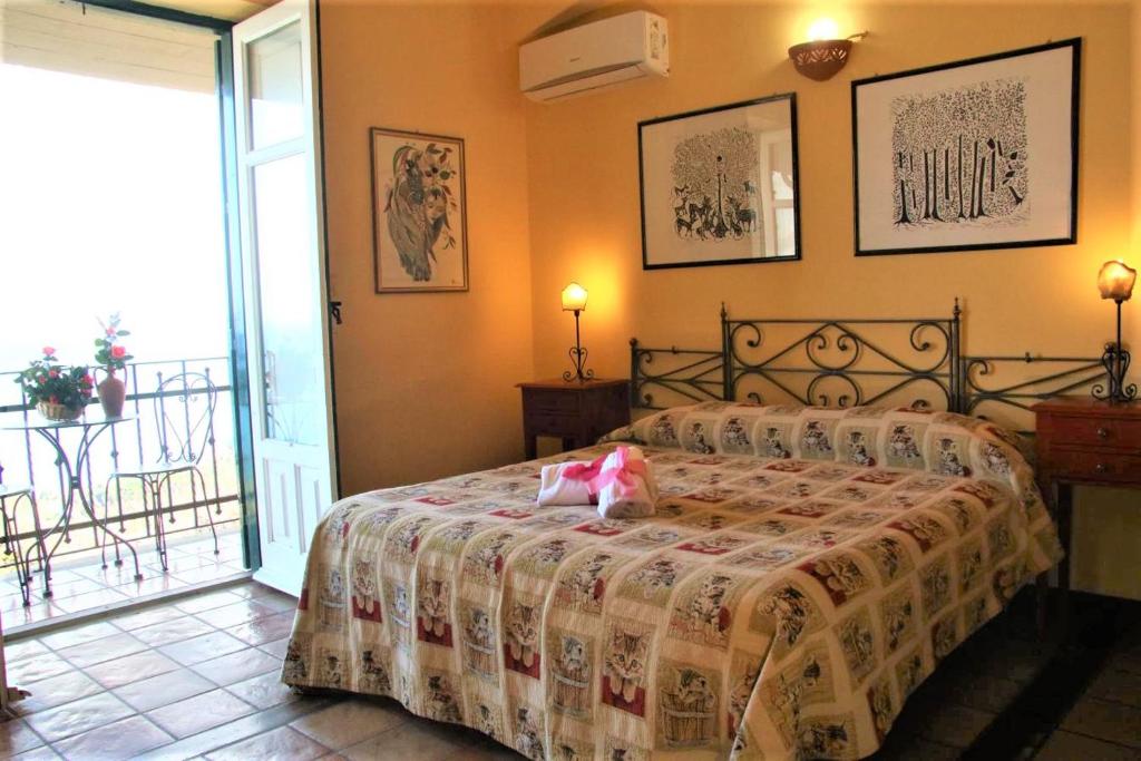 Postel nebo postele na pokoji v ubytování Agriturismo Santa Margherita