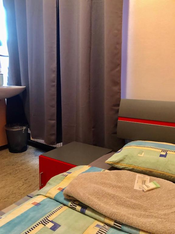 Letto o letti in una camera di Auberge Pour Tous