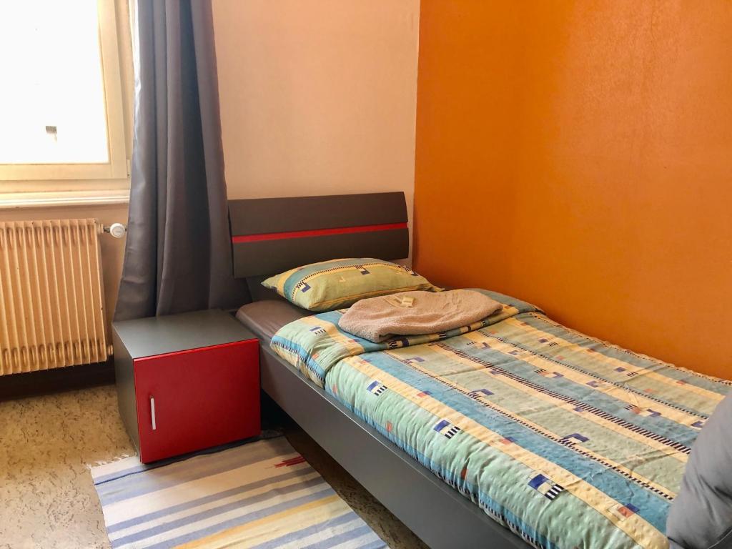 Letto o letti in una camera di Auberge Pour Tous
