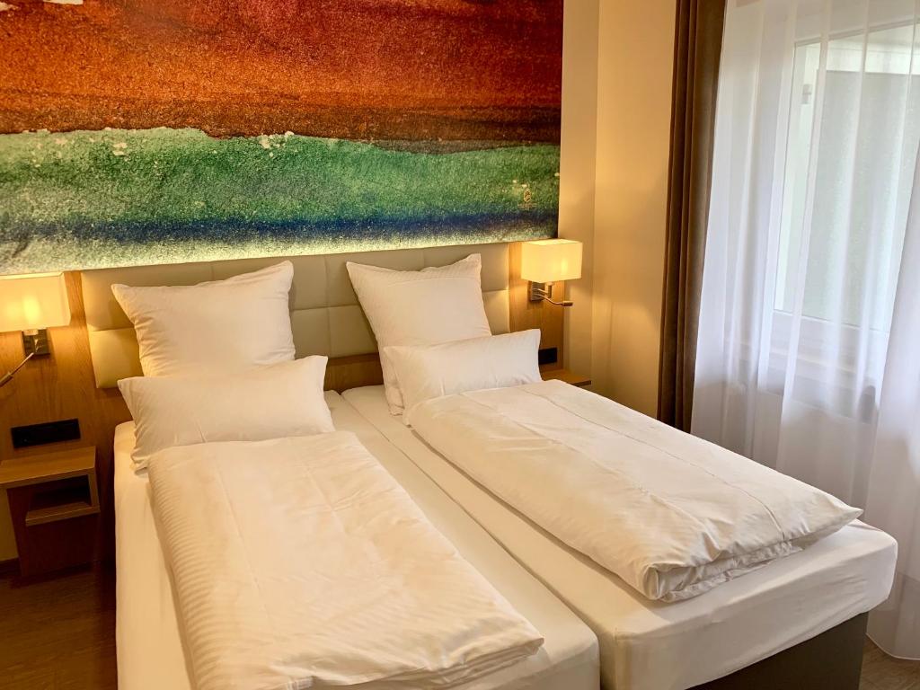 Postel nebo postele na pokoji v ubytování Thermalhotel Kemper