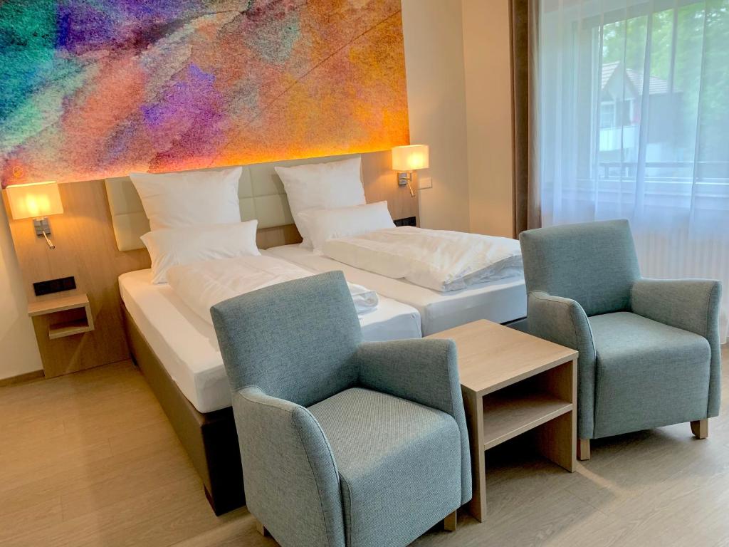 Postel nebo postele na pokoji v ubytování Thermalhotel Kemper