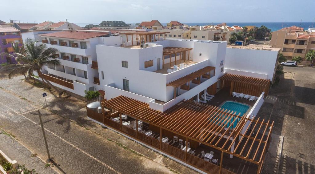 an aerial view of a white house with a swimming pool at Hotel Da Luz in Santa Maria