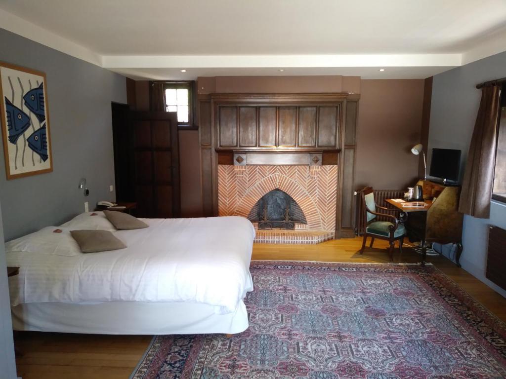 Postel nebo postele na pokoji v ubytování Manoir Dalmore