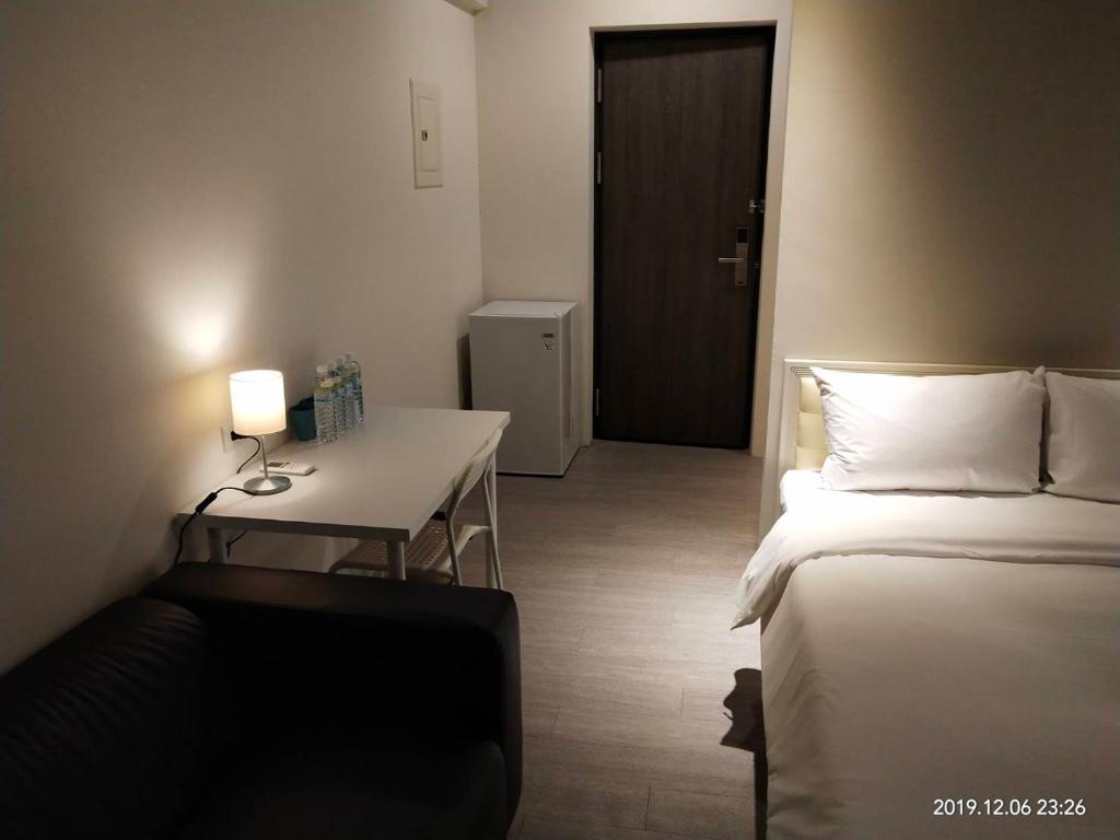 Postel nebo postele na pokoji v ubytování 駐駐逢甲 Shine Residence