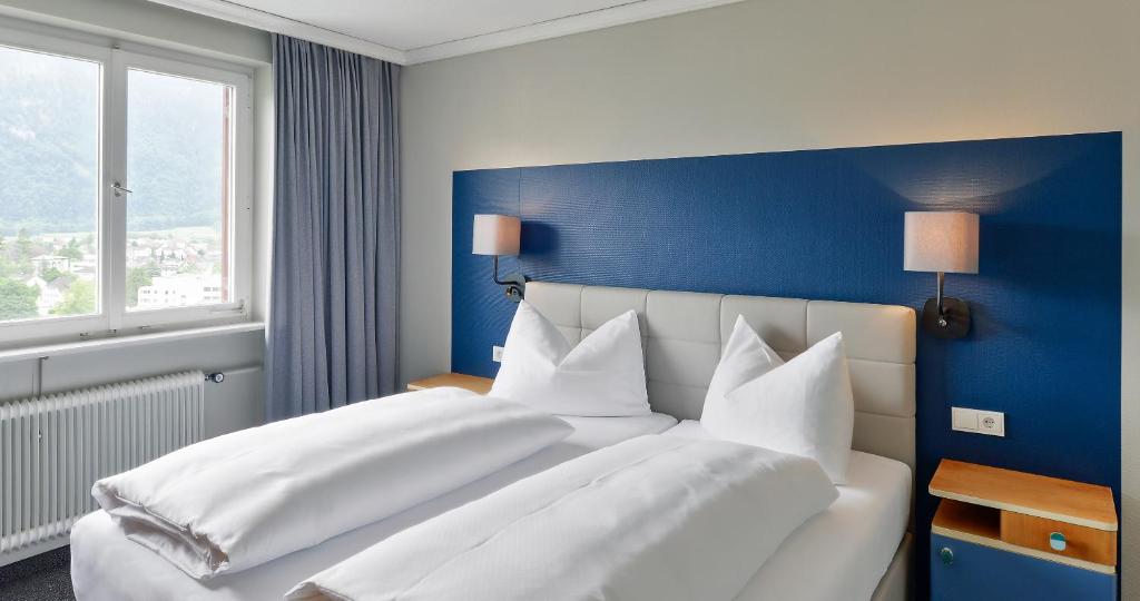 Postel nebo postele na pokoji v ubytování Schlosshotel Dörflinger