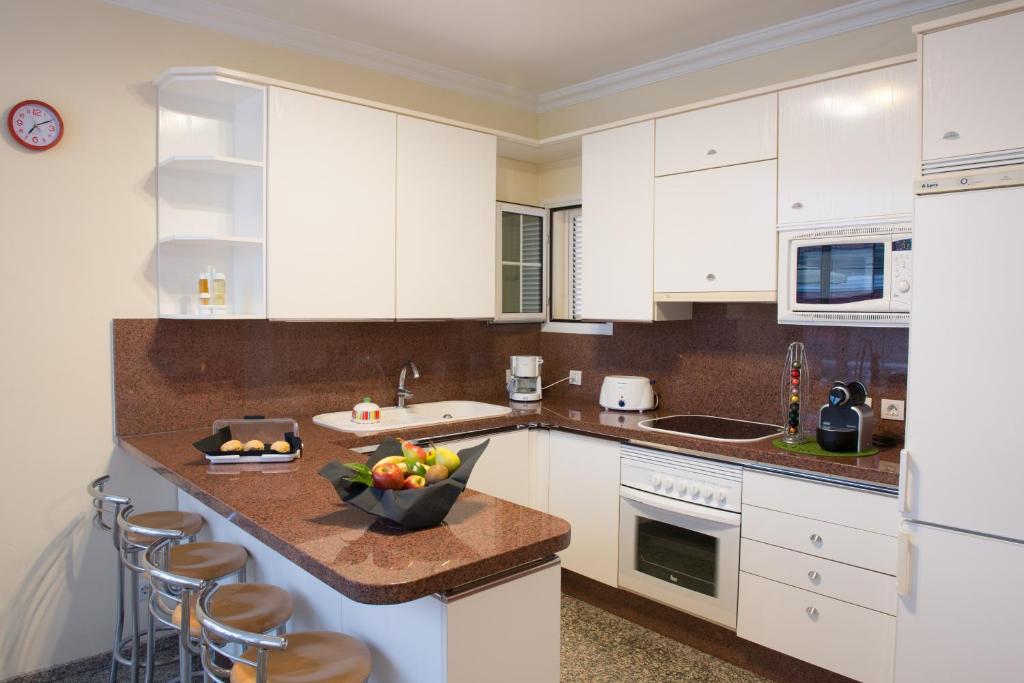 Kuchyň nebo kuchyňský kout v ubytování Siesta Suites