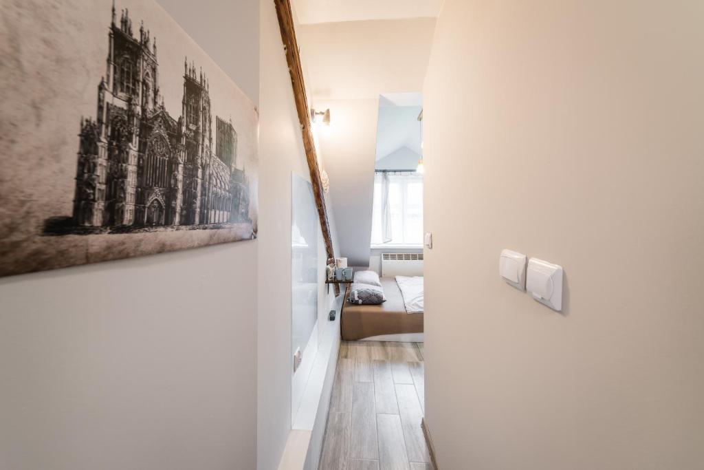 a hallway with a door leading to a living room at Bingi in Krakow