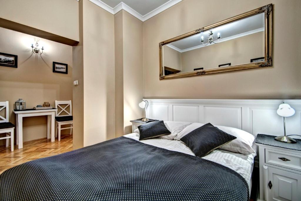 Posteľ alebo postele v izbe v ubytovaní Apartamenty Pod Baranami