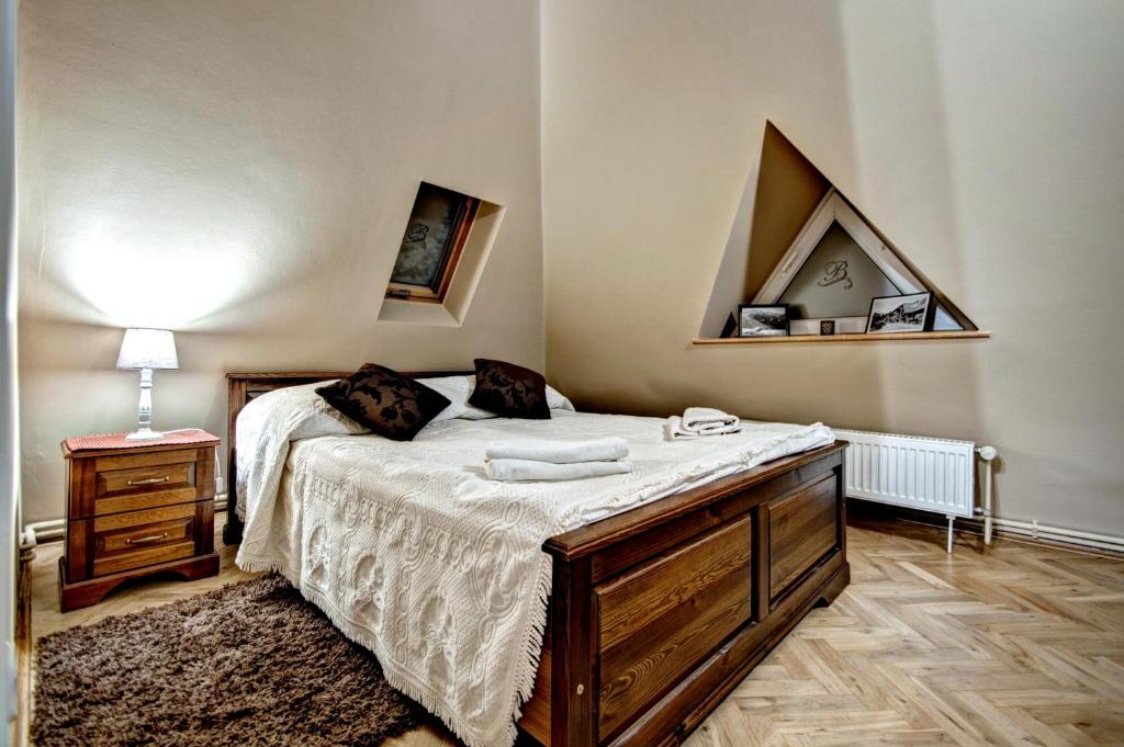 Posteľ alebo postele v izbe v ubytovaní Apartamenty Pod Baranami