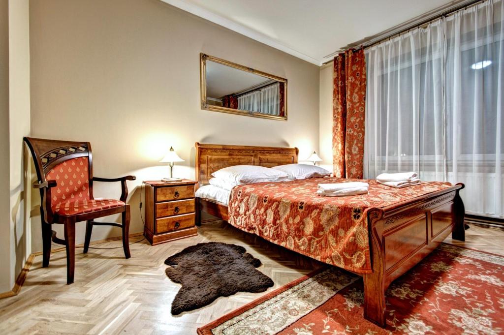 Posteľ alebo postele v izbe v ubytovaní Apartamenty Pod Baranami