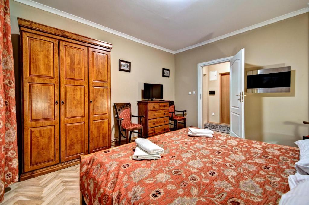 Posteľ alebo postele v izbe v ubytovaní Apartamenty Pod Baranami