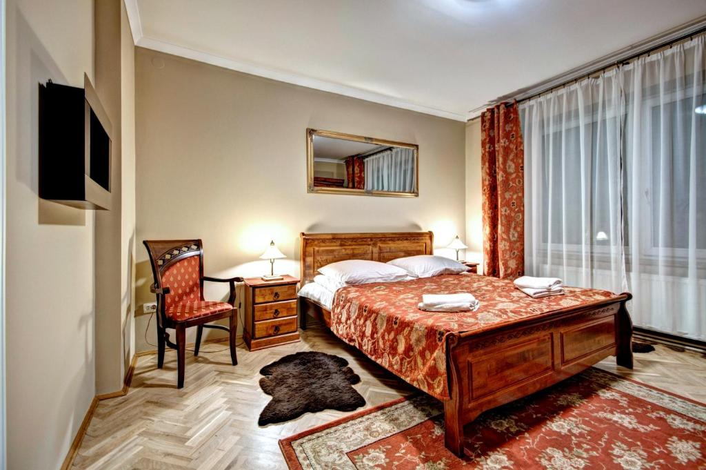 Posteľ alebo postele v izbe v ubytovaní Apartamenty Pod Baranami