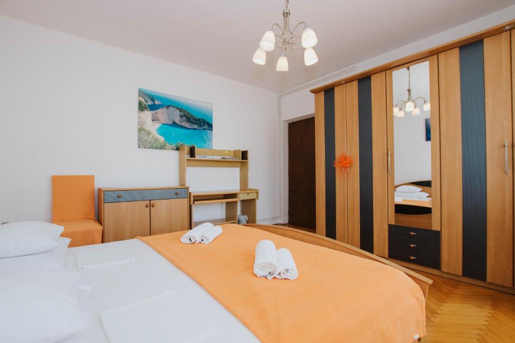 Postel nebo postele na pokoji v ubytování Bugenvila