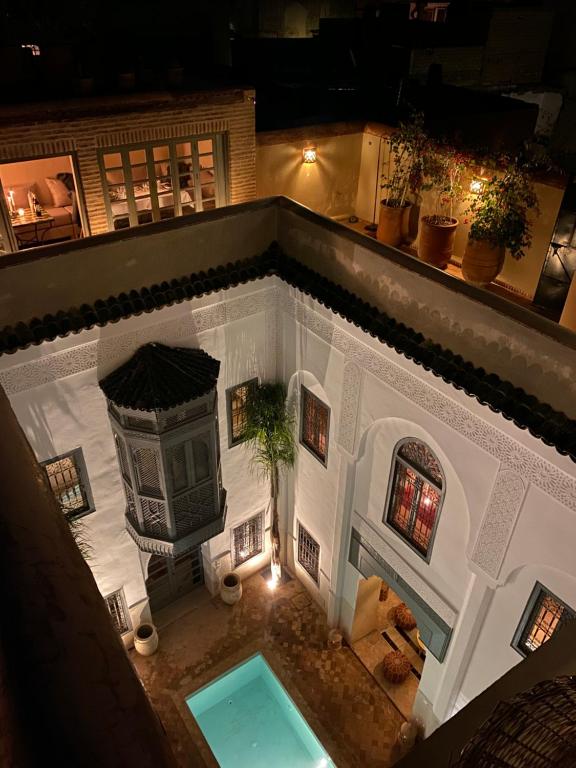 an overhead view of a house with a swimming pool at Riad Hadika Maria in Marrakesh