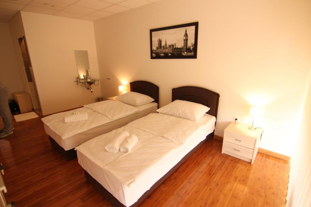 Posteľ alebo postele v izbe v ubytovaní Rooms XXL