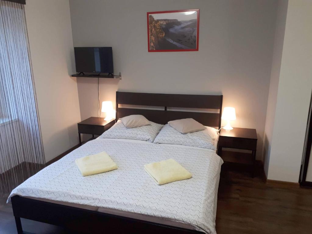 Łóżko lub łóżka w pokoju w obiekcie Bohemica Apartments