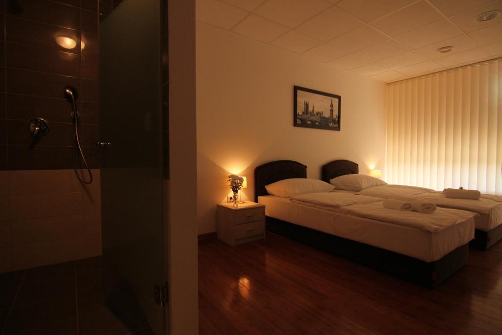 Posteľ alebo postele v izbe v ubytovaní Rooms XXL