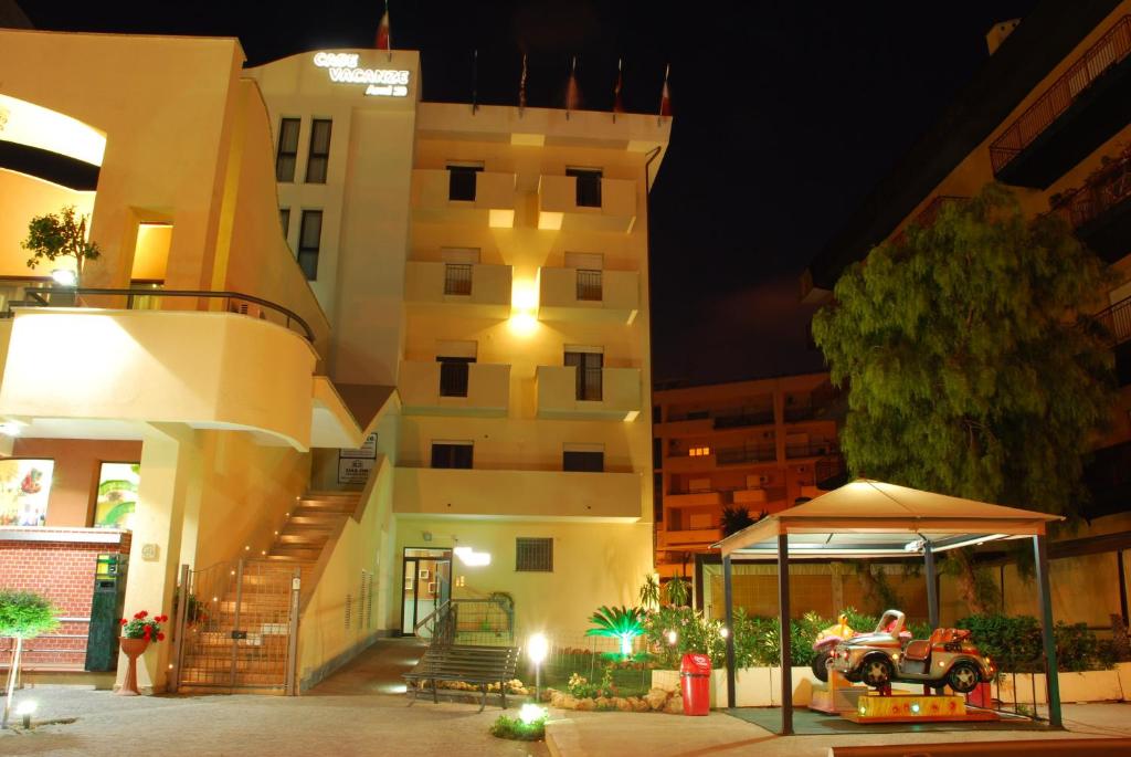 a building with a table in front of it at night at Case Vacanze Anni 20 in Bagheria