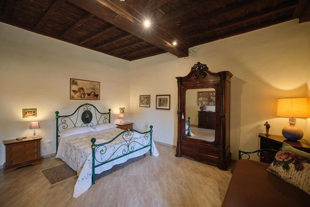 Postel nebo postele na pokoji v ubytování Palazzo Mazzini