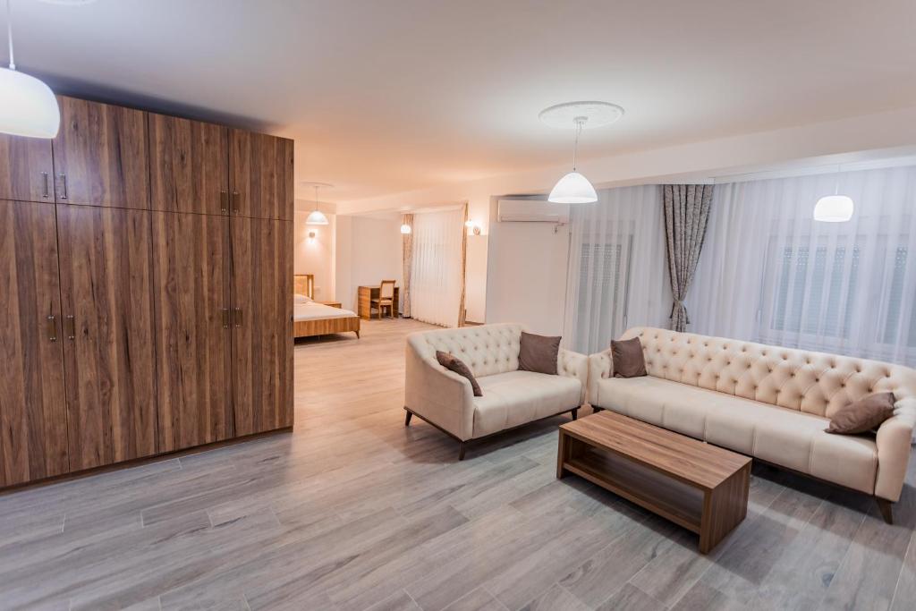 a living room with a couch and a coffee table at CITY HOTEL in Ferizaj