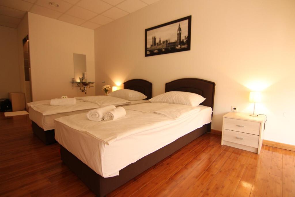 Posteľ alebo postele v izbe v ubytovaní Rooms XXL