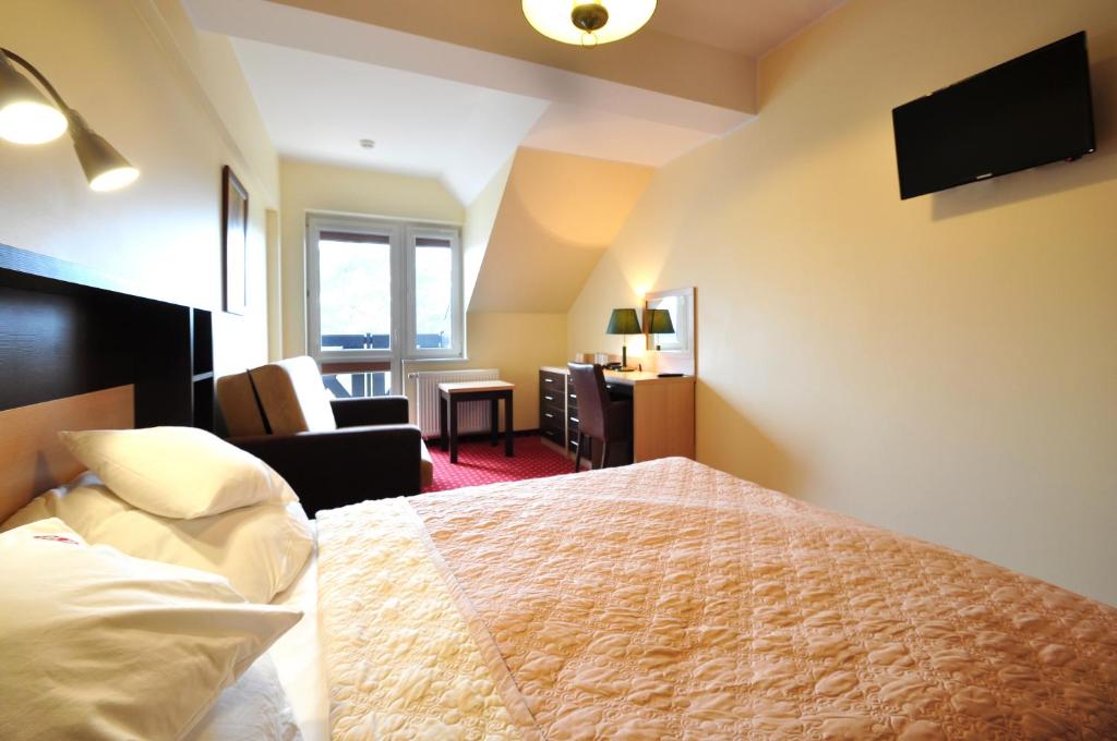 Postel nebo postele na pokoji v ubytování Hotel Continental