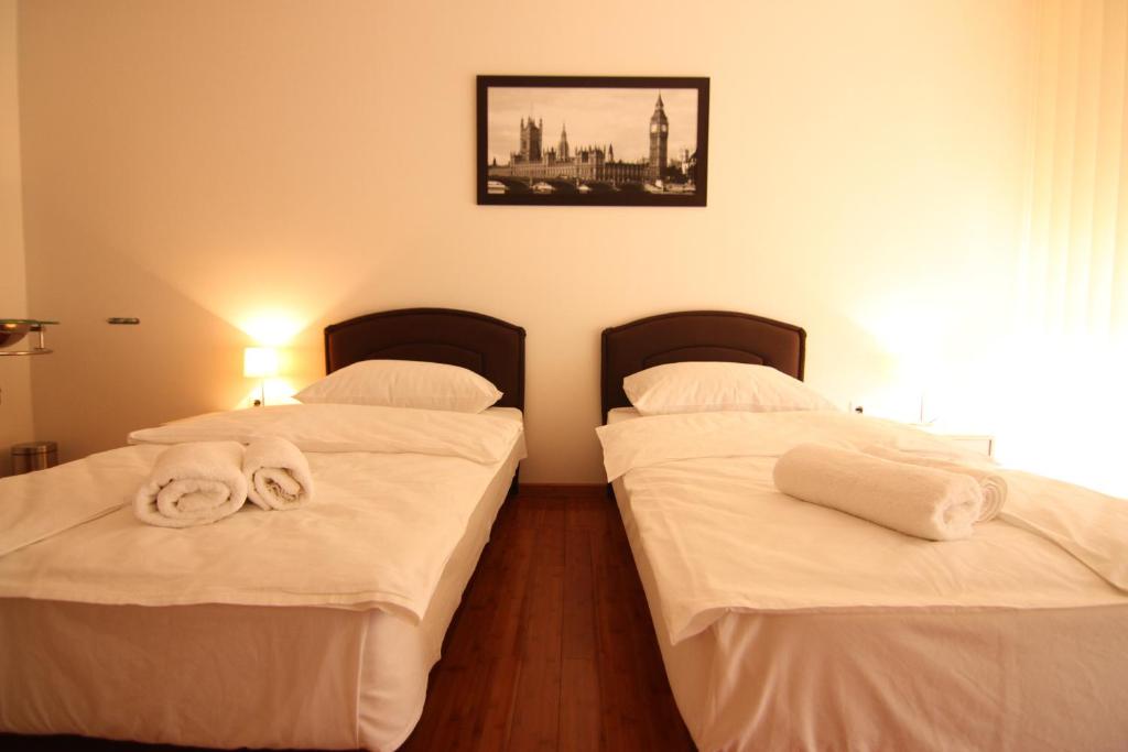 Posteľ alebo postele v izbe v ubytovaní Rooms XXL