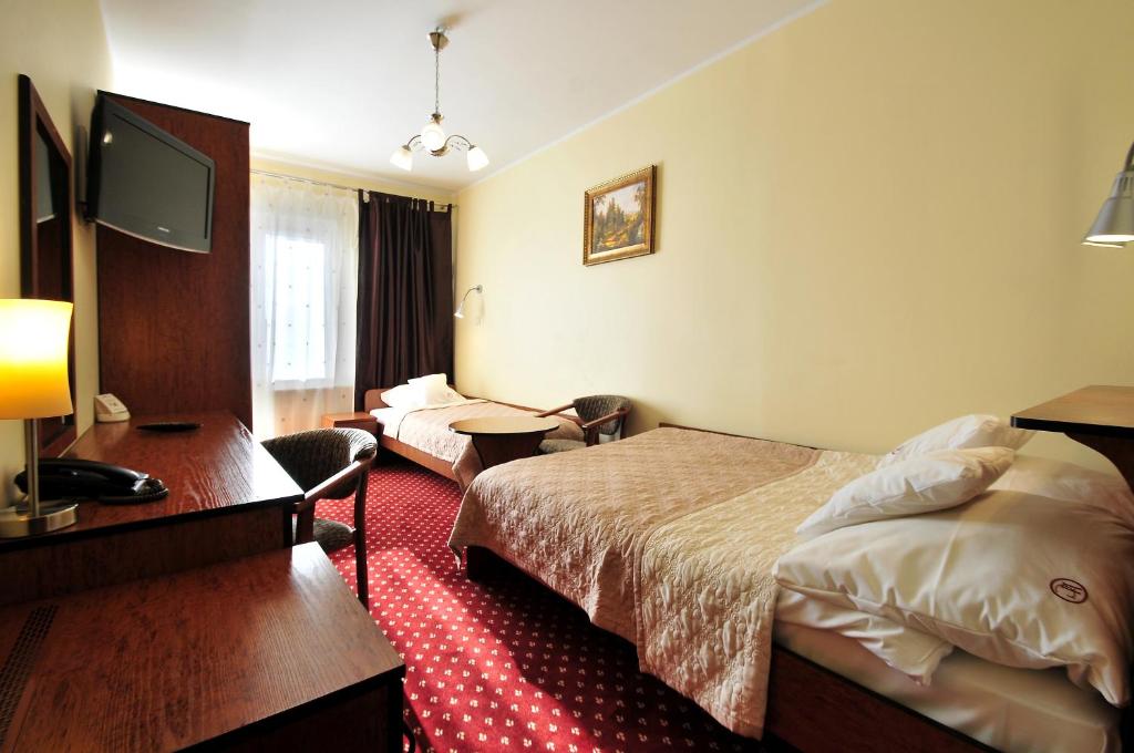 Postel nebo postele na pokoji v ubytování Hotel Continental