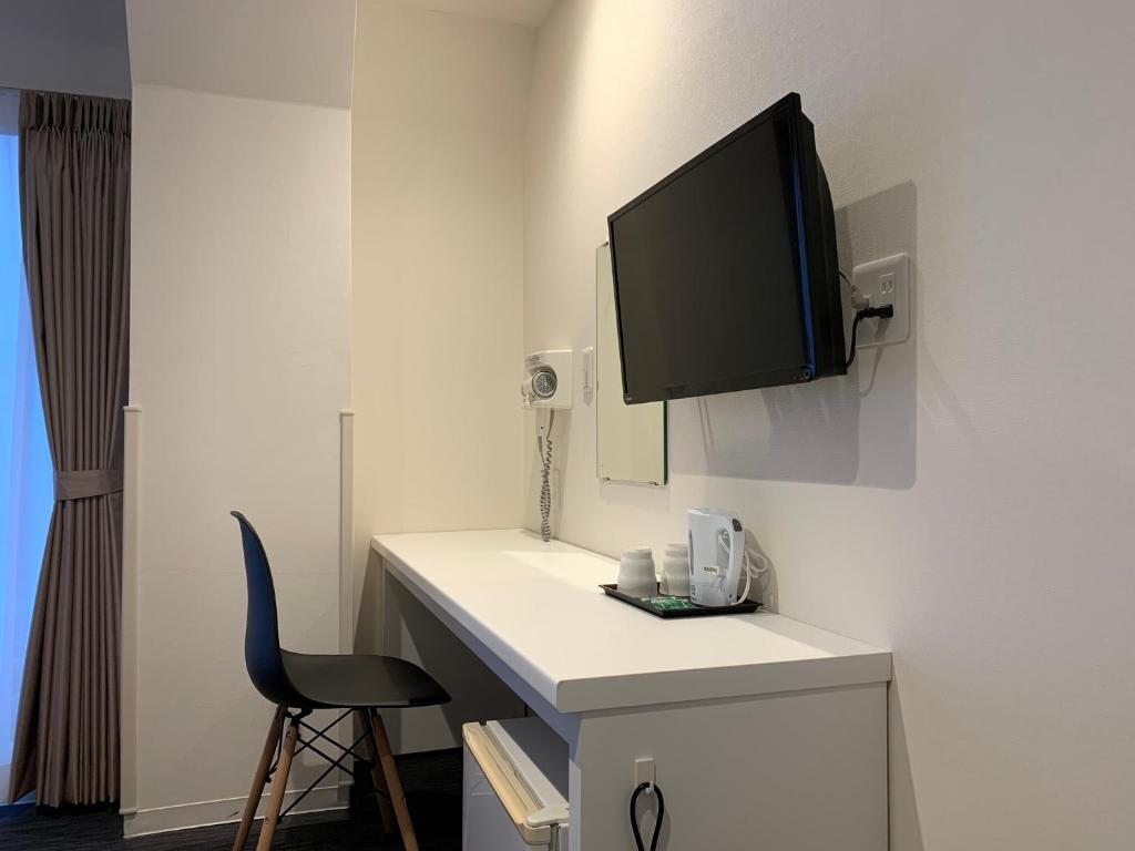 TV a/nebo společenská místnost v ubytování Hotel New Tohoku