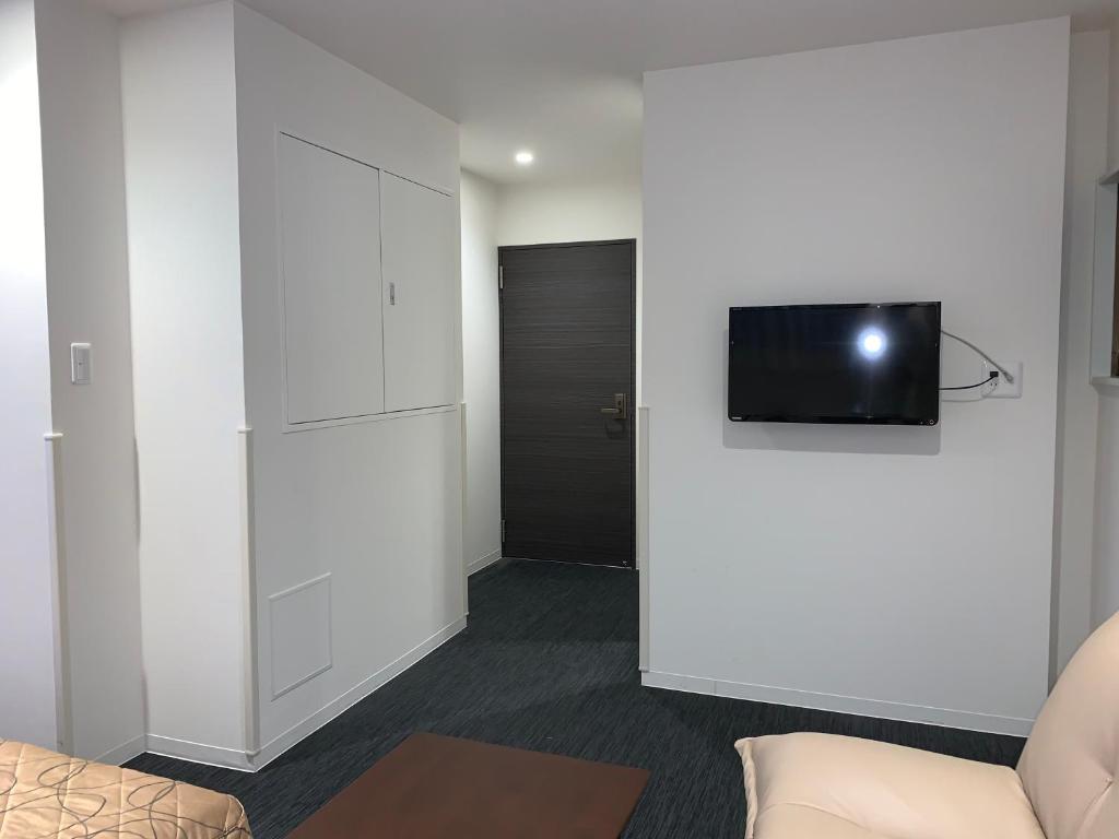 TV a/nebo společenská místnost v ubytování Hotel New Tohoku