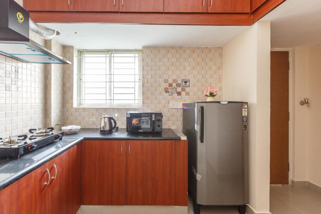 Kuchyň nebo kuchyňský kout v ubytování Misty Meridian Serviced Apartments
