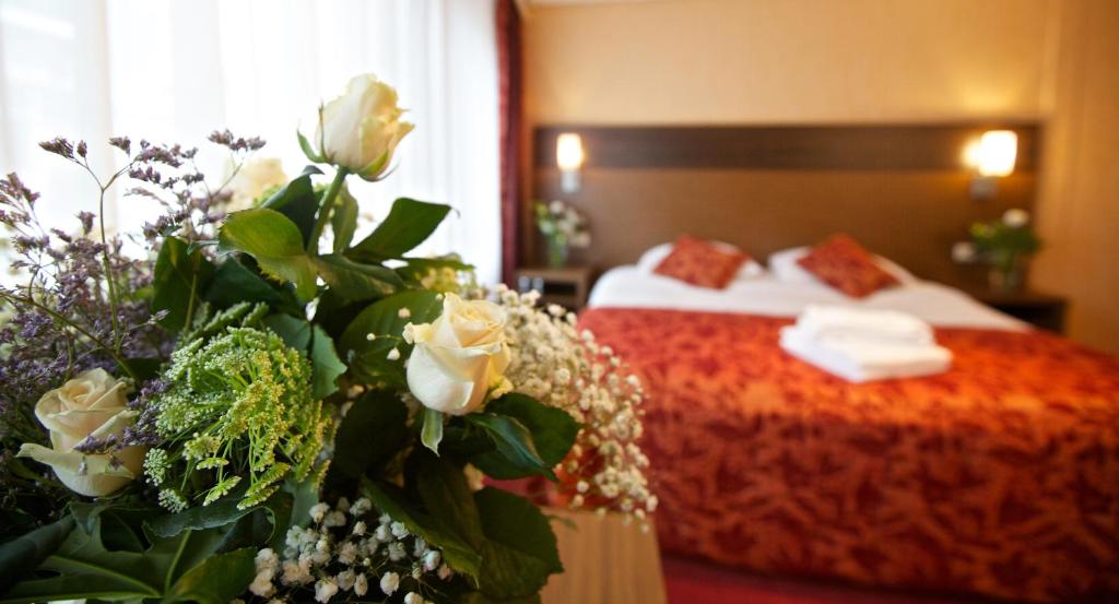 Postel nebo postele na pokoji v ubytování Hampshire Hotel Petit Nord
