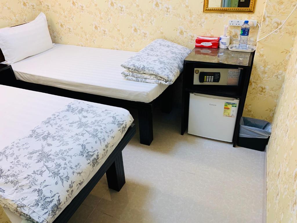 Postel nebo postele na pokoji v ubytování Victoria Inn